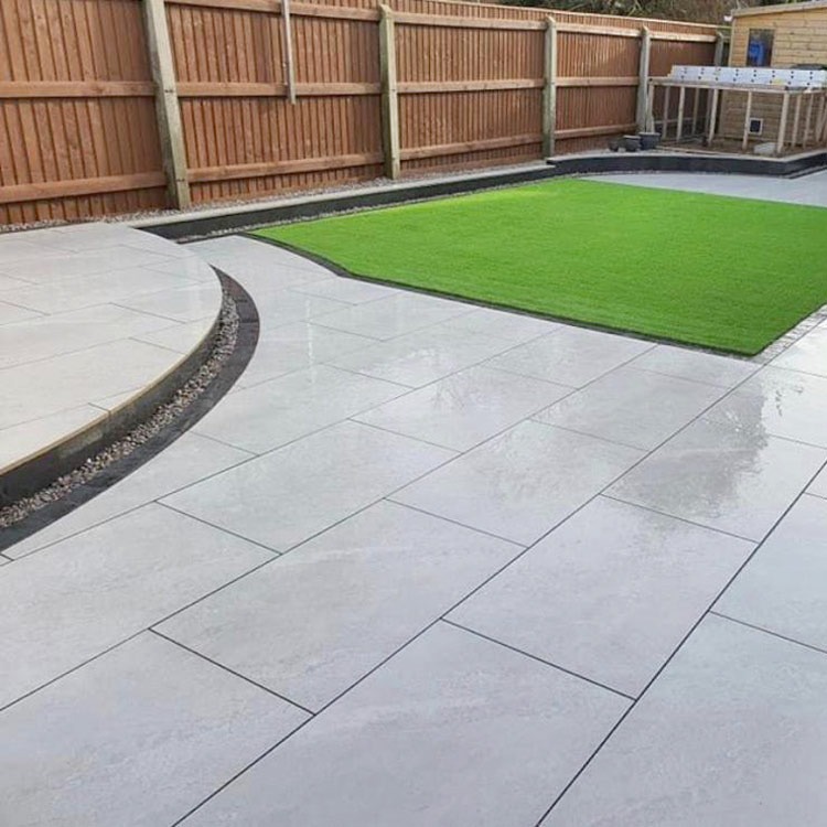 Completed porcelain-style patio and low-maintenance garden by Harcourt Exteriors