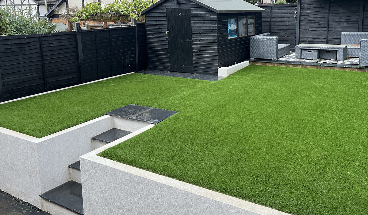 Completed landscaped garden with paving and lawn by Harcourt Exteriors
