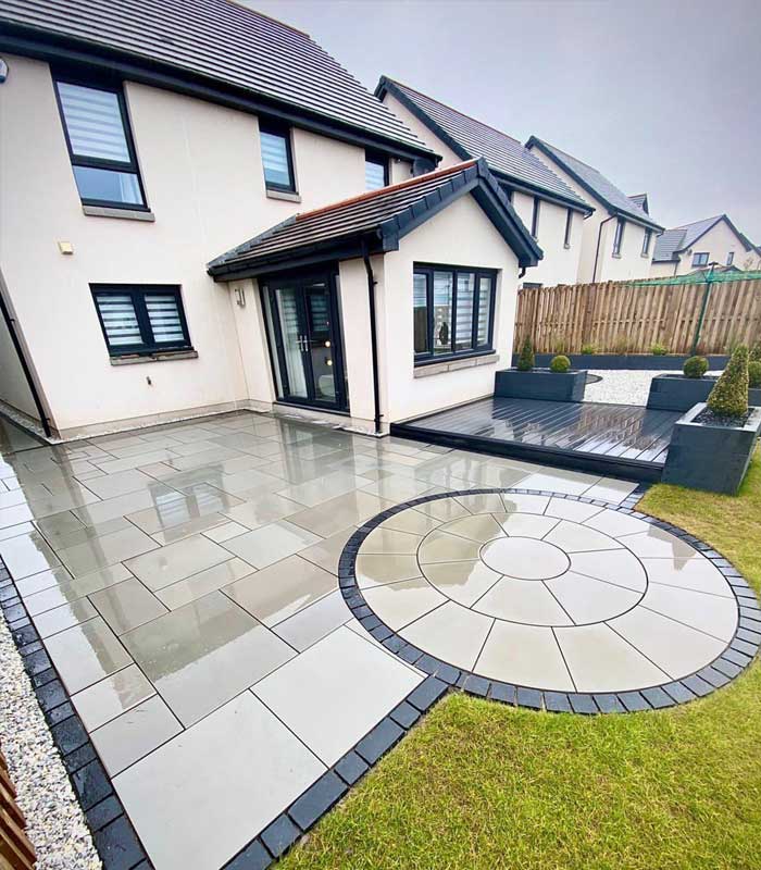 Completed Harcourt Exteriors porcelain patio and landscaped garden