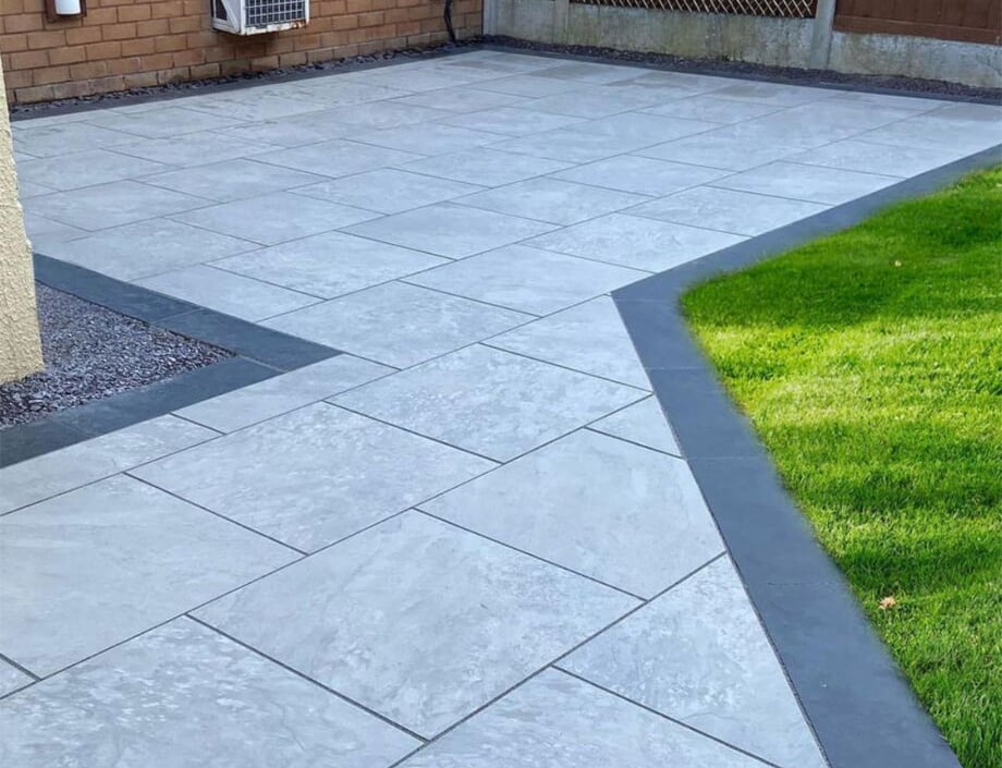 Light grey porcelain patio with a dark contrasting border
