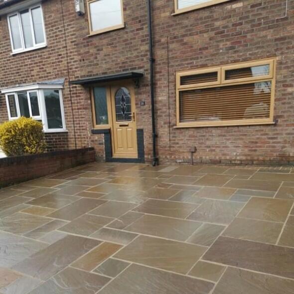 Natural sandstone paving across a front entrance